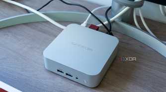 Angled view of the Geekom A8 mini PC with multiple peripherals connected