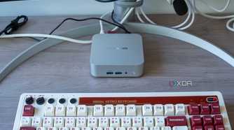 A Geekom A8 mini PC with a keyboard in front of it