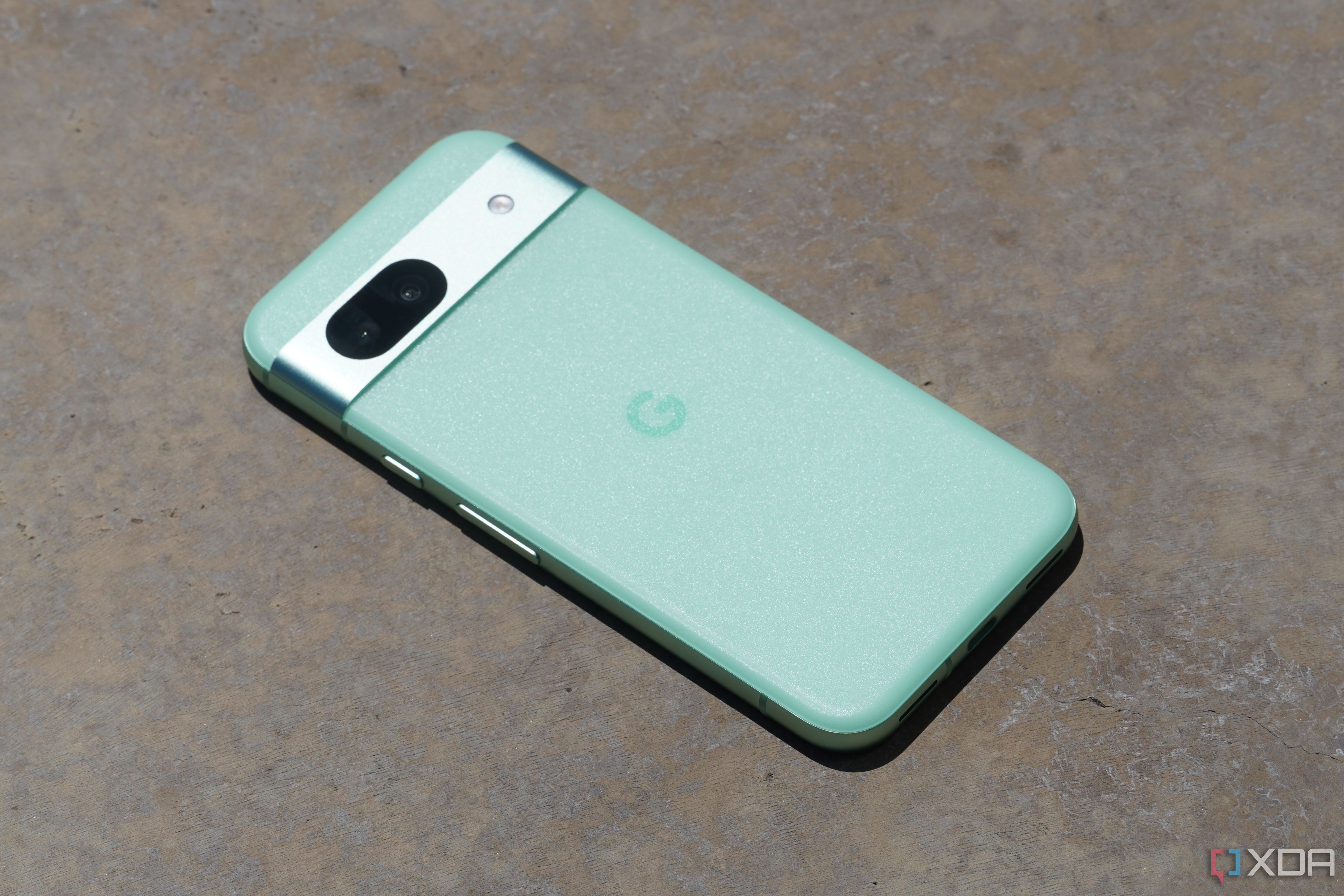 The Pixel 8a on concrete.
