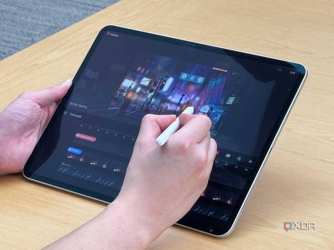 A person using the Apple Pencil Pro on the iPad Pro to edit video