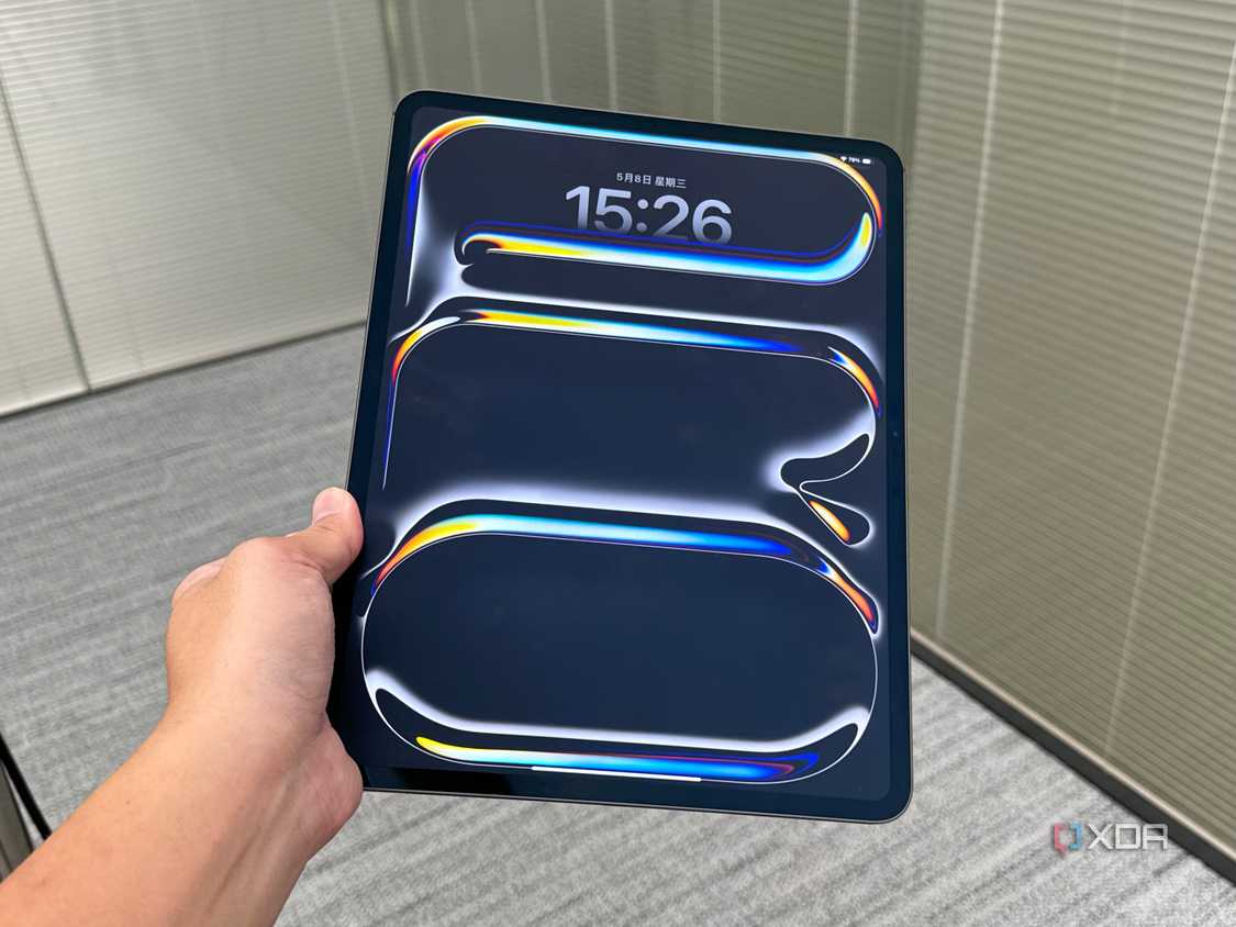 A 2024 iPad Pro held in a person's hand