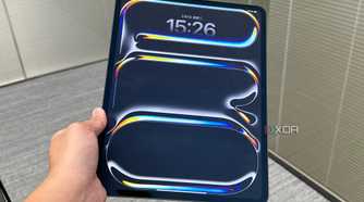 A 2024 iPad Pro held in a person's hand