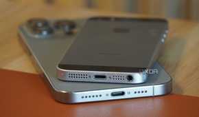 Two iPhones on a desk.