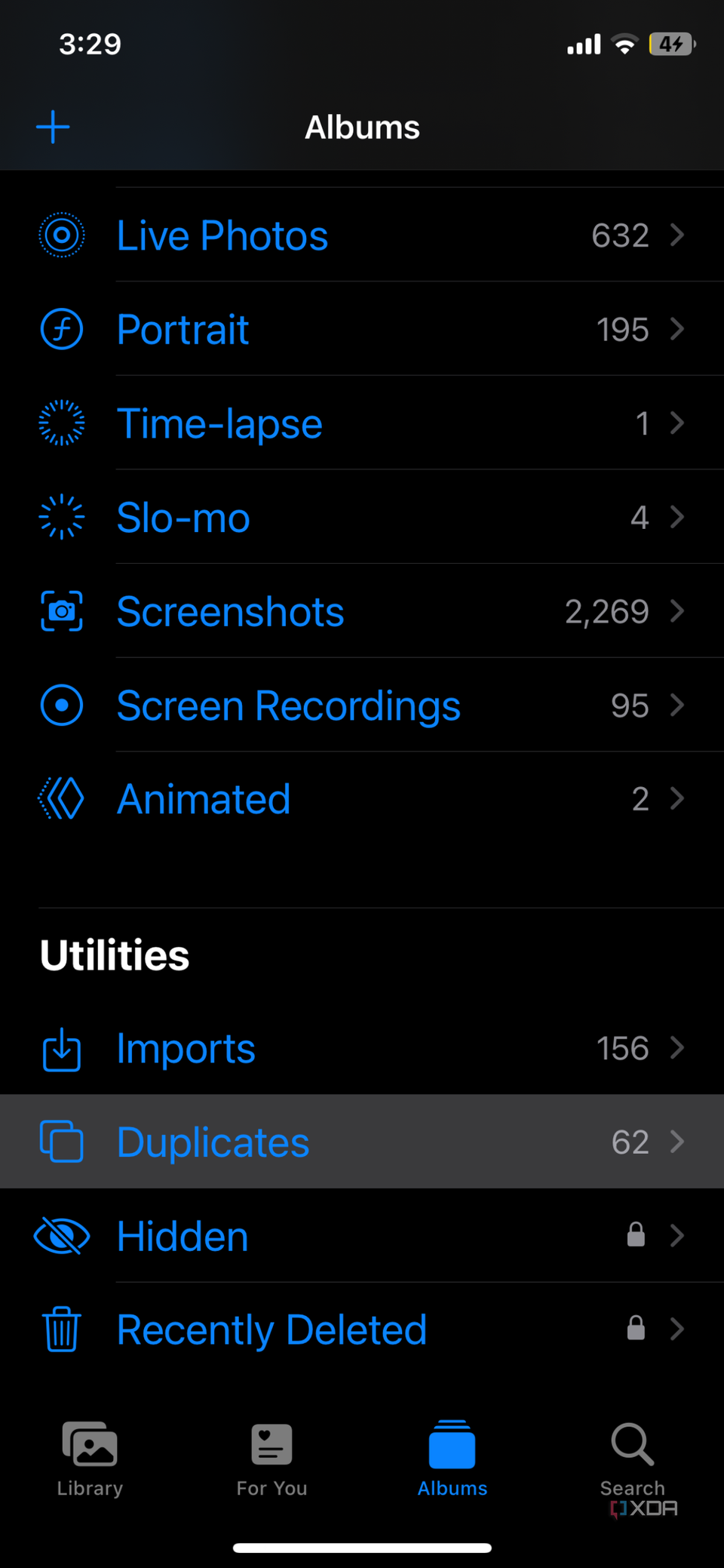 iOS screenshot that highlights the Duplicates option in the Photos app
