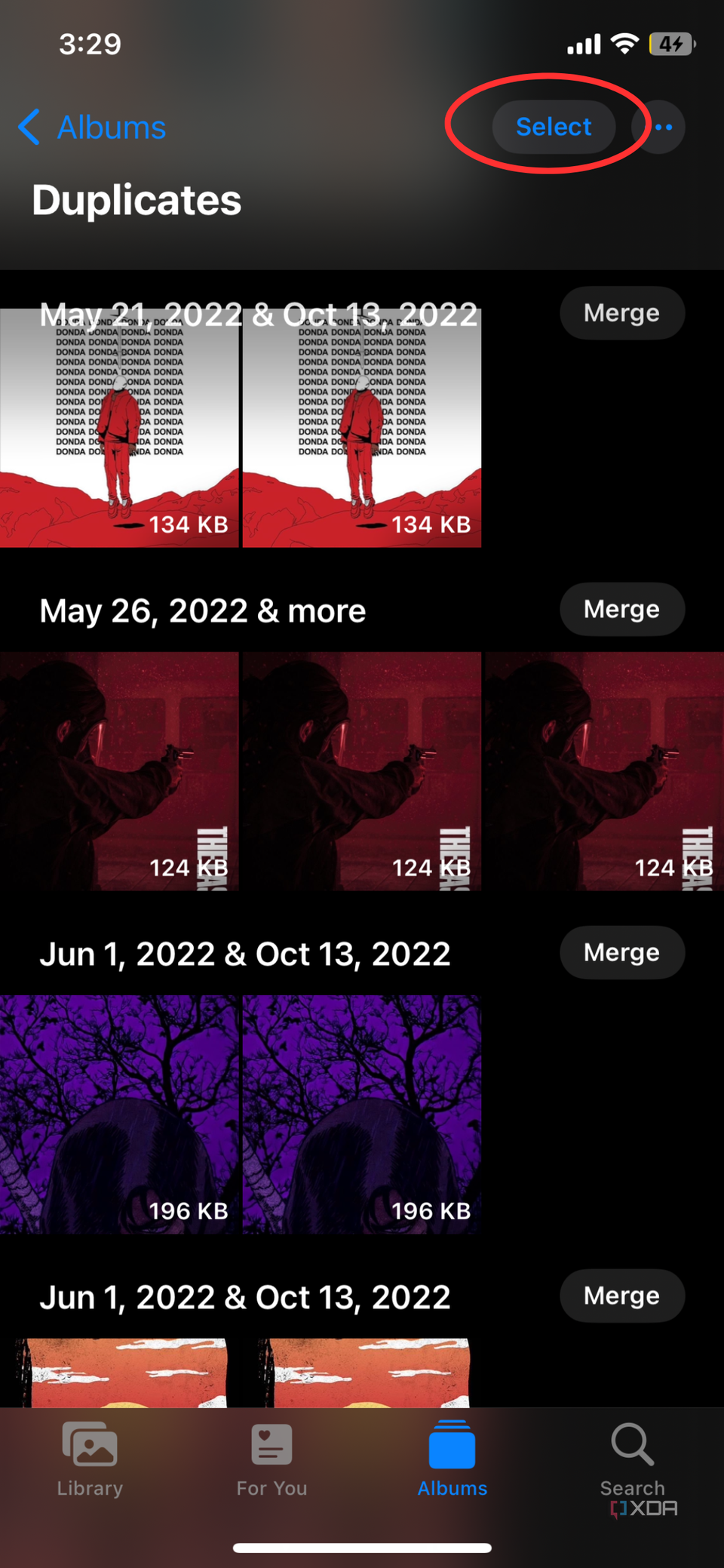 iPhone Photos app screenshot that highlights the Select option in the Duplicates album