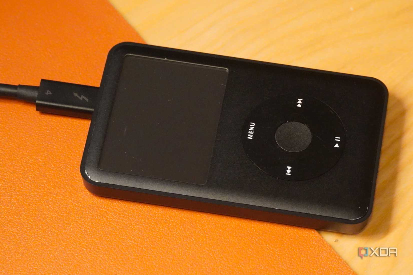 A USB-C cable connected to an iPod Classic.