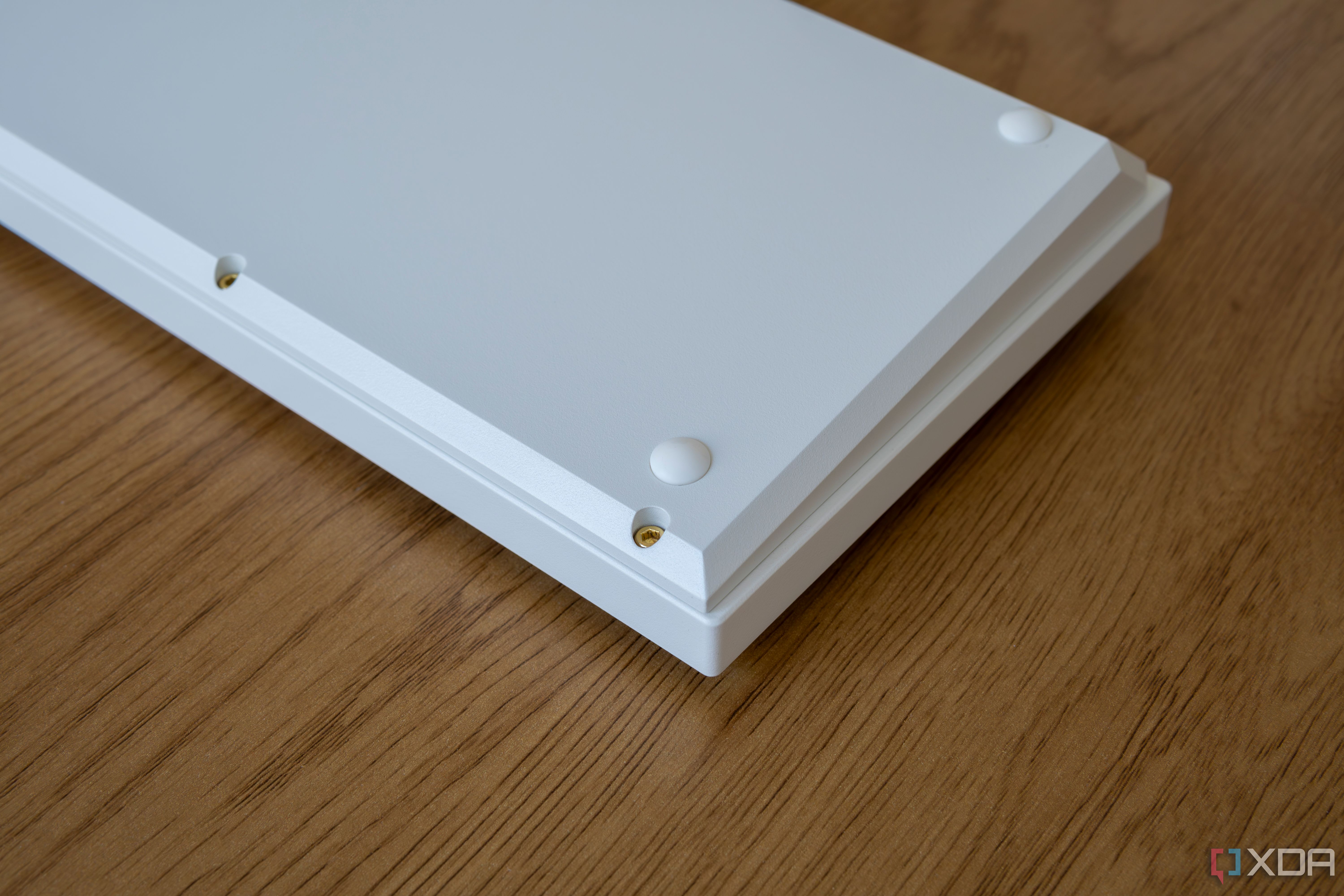 Underside of the Keychron Q1 HE showing hex key screws