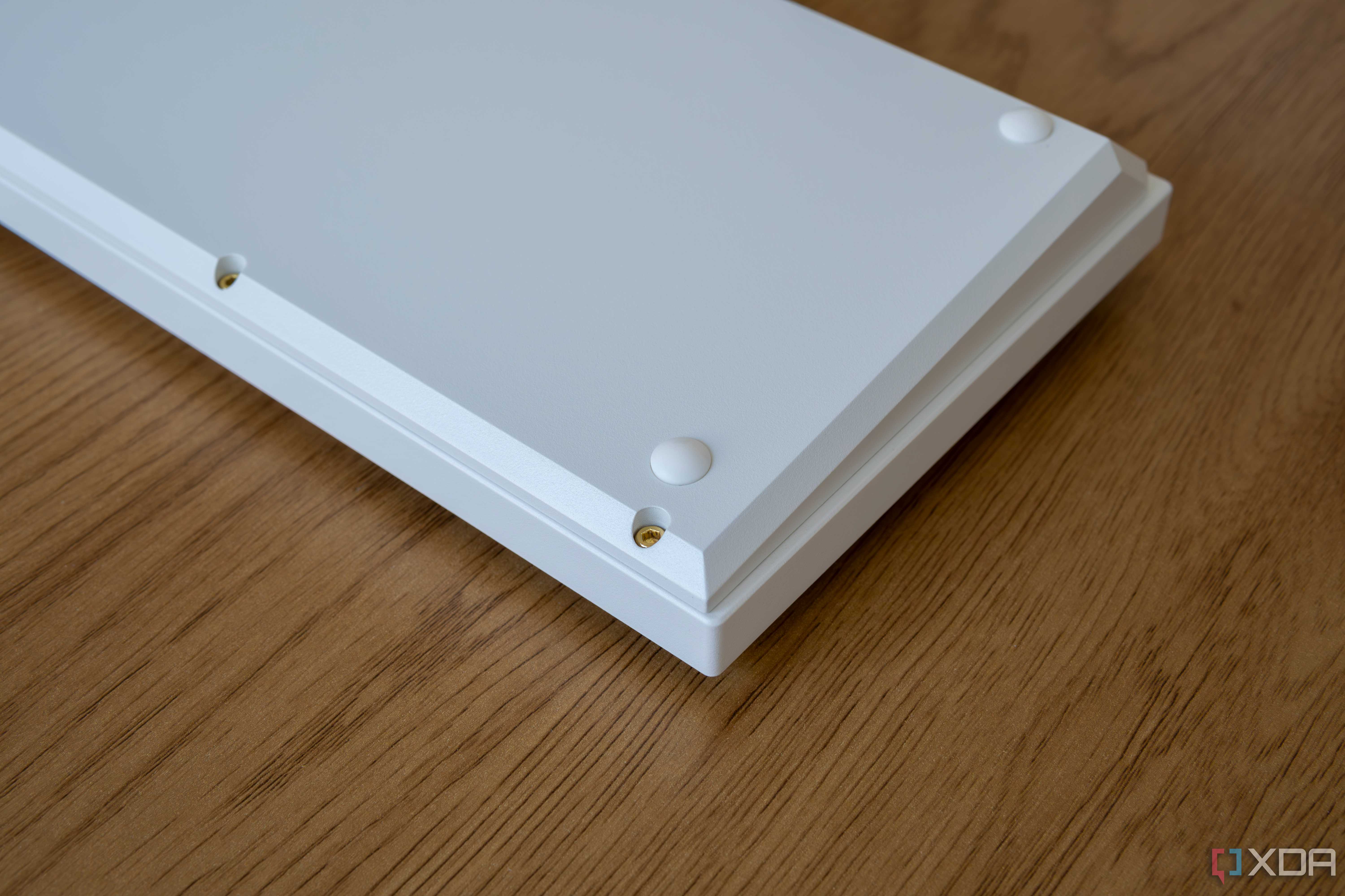 Underside of the Keychron Q1 HE showing hex key screws