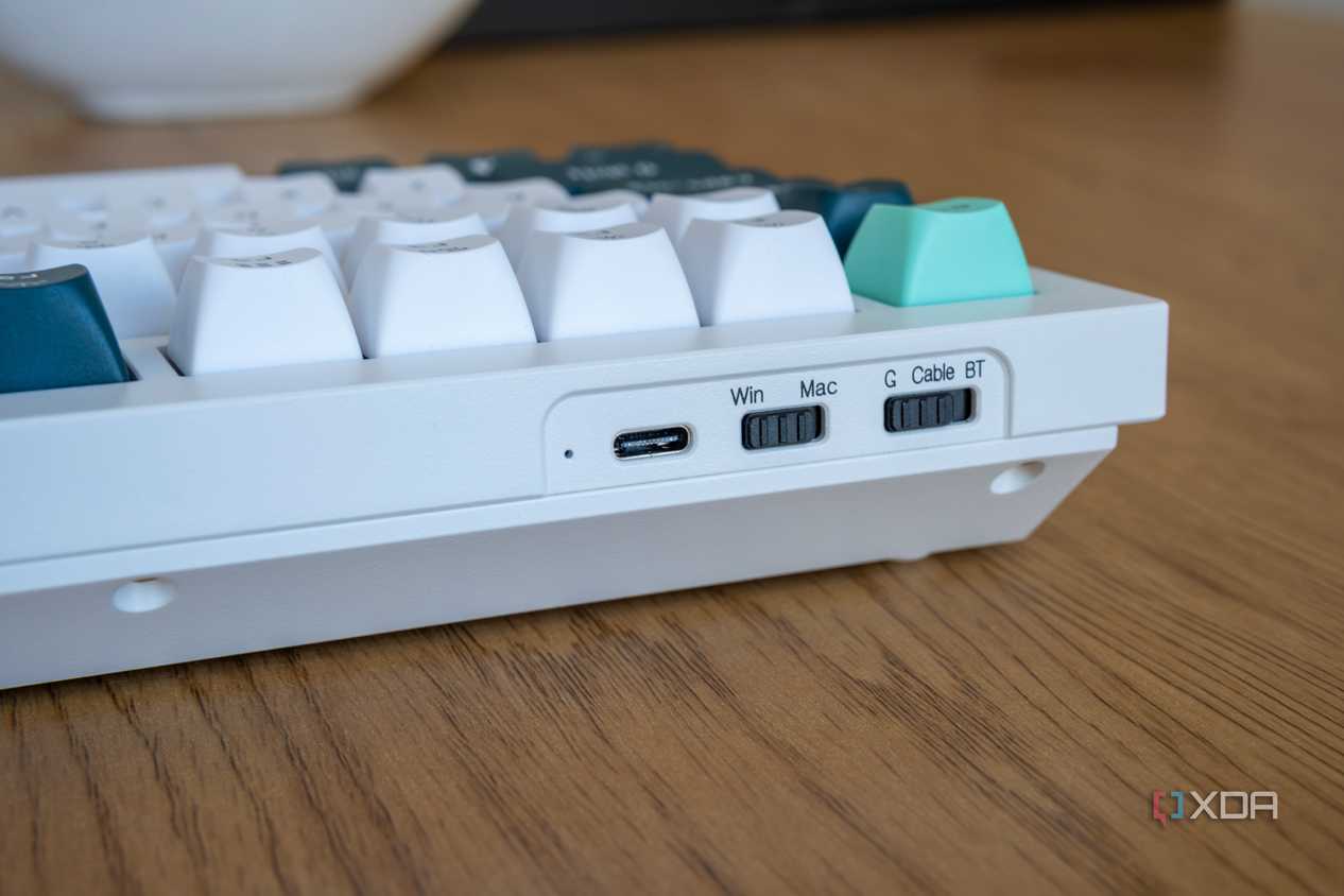 Close-up of the OS and mode switches on the Keychron Q1 HE