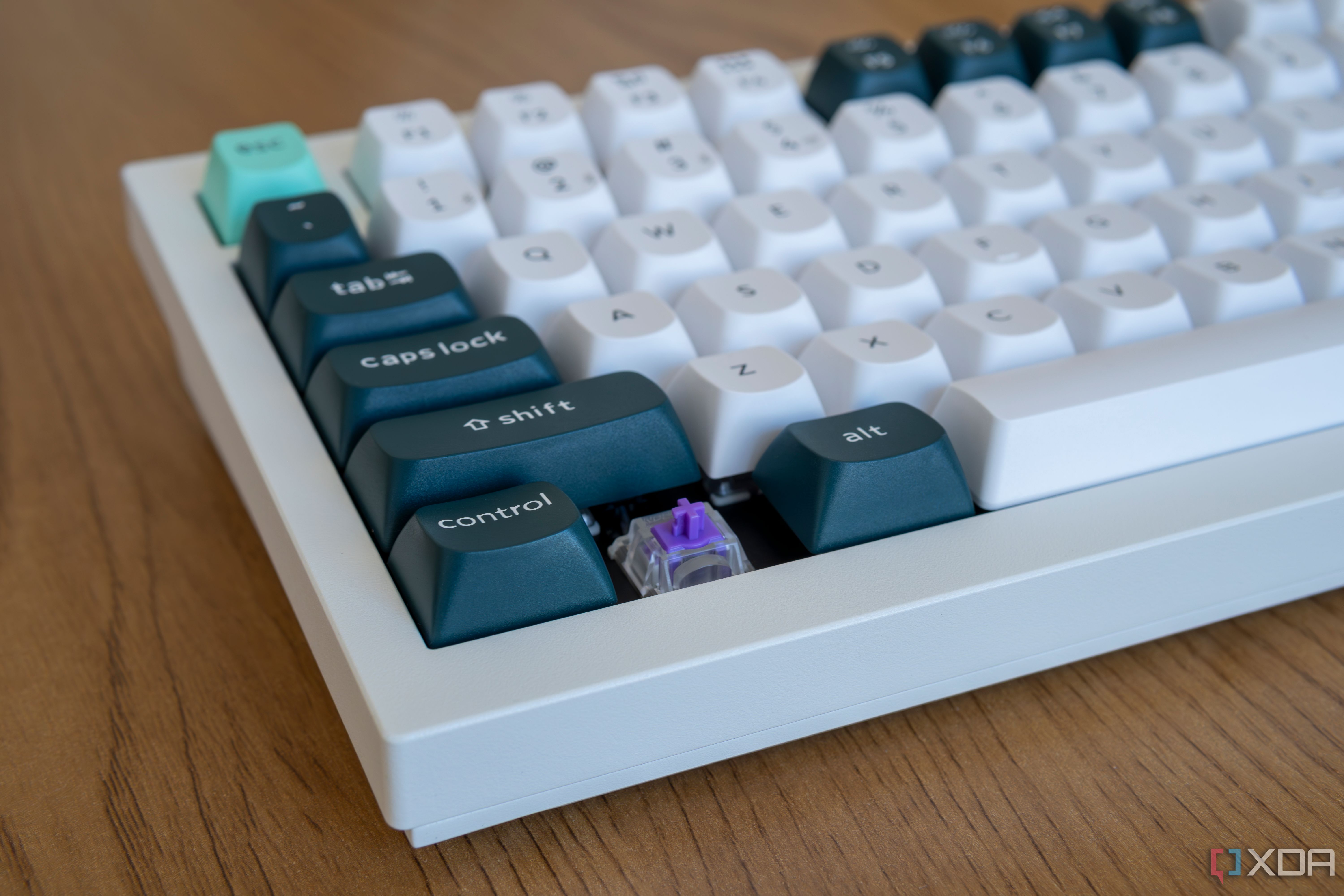 Close-up of the corner keys on the Keychron Q1 HE with one of the keycaps removed