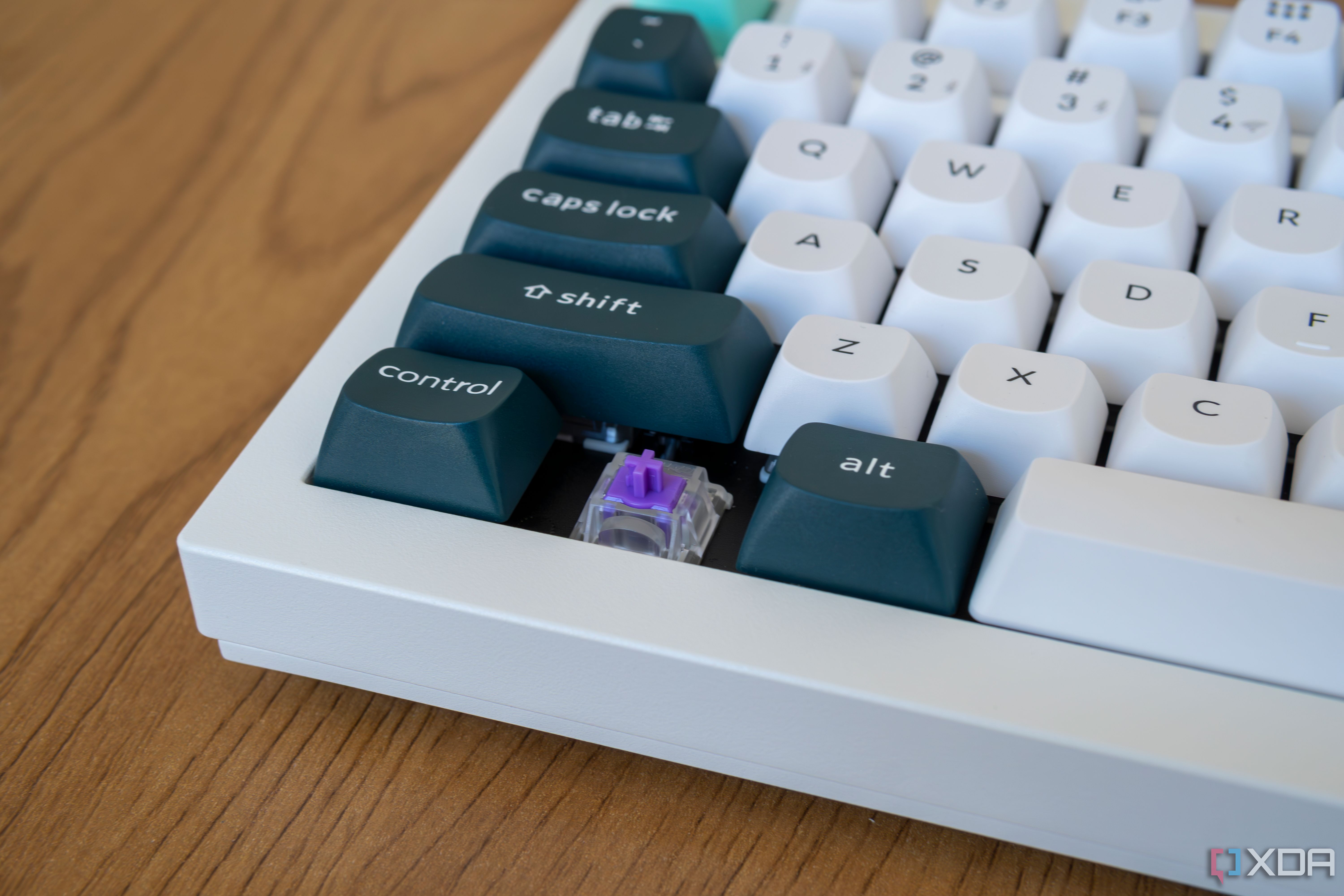 Close-up of the corner keys on the Keychron Q1 HE with one of the keycaps removed