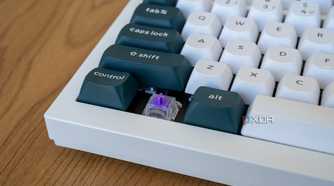 Close-up of the corner keys on the Keychron Q1 HE with one of the keycaps removed