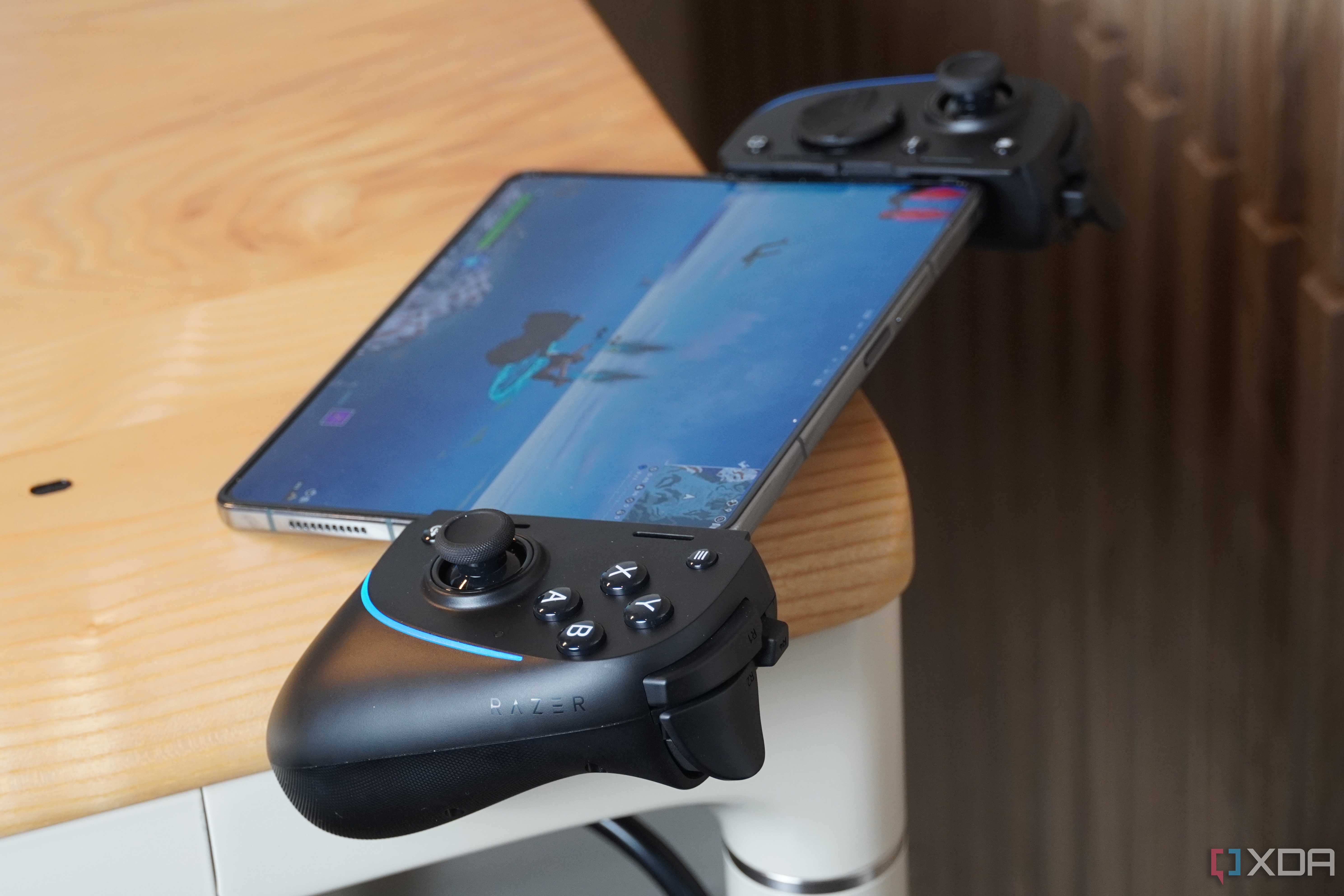 The Razer Kishi Ultra on a desk connected to a foldable.