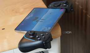 The Razer Kishi Ultra on a desk connected to a foldable.