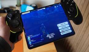 The Razer Kishi Ultra in hand connected to a foldable.