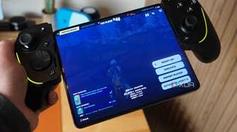 The Razer Kishi Ultra in hand connected to a foldable.