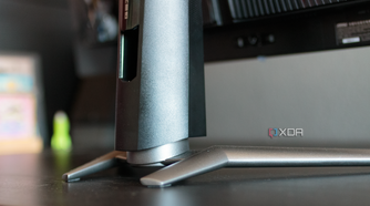 A close-up of the rear of the feet and stand of the MSI MAG 341CQP.