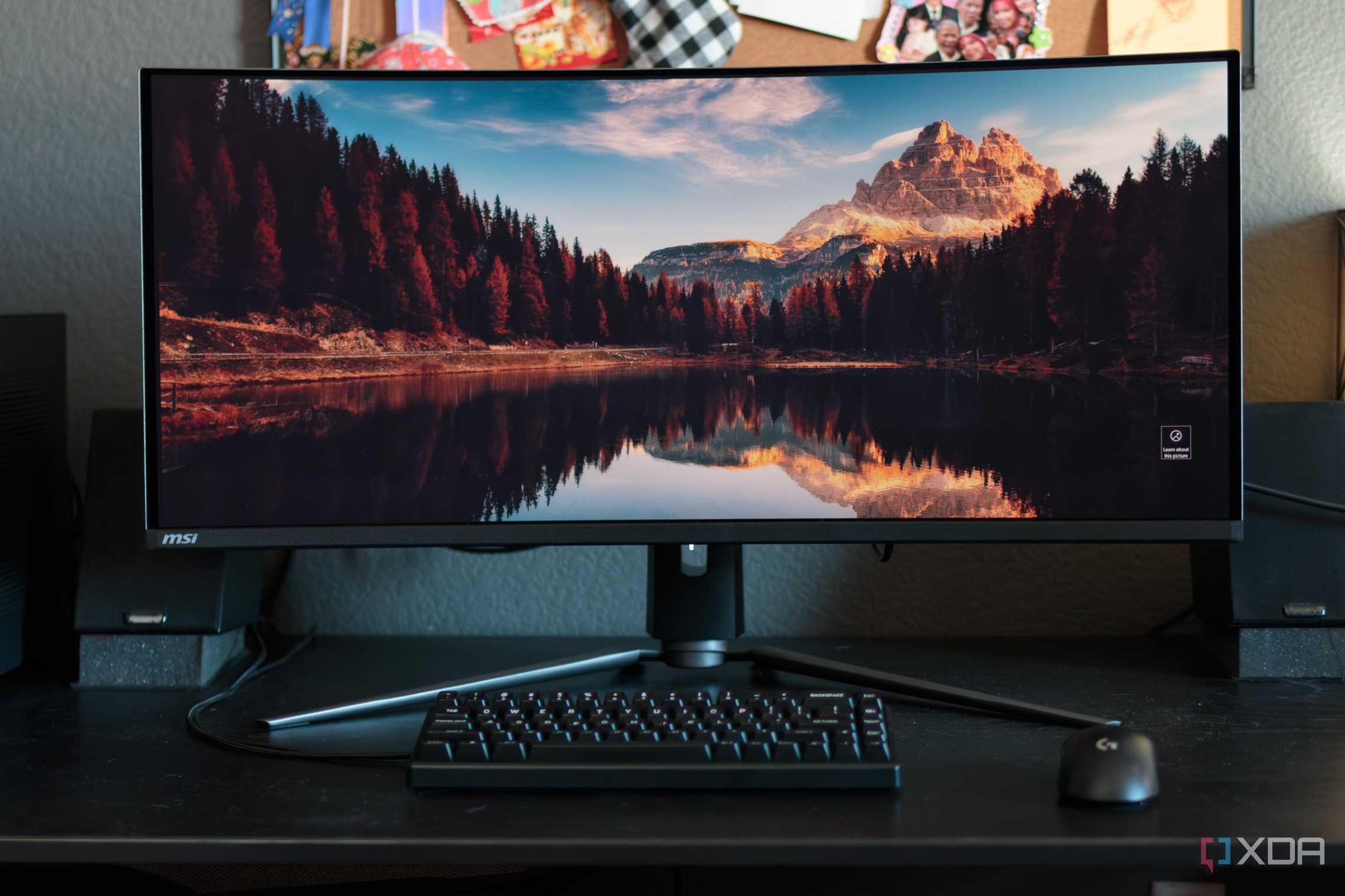 The front of the MSI MAG 341CQP with a mouse and keyboard.