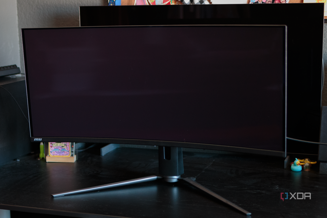 A comparison of the black levels with the MSI MAG 341CQP QD-OLED in the front and the LG 42C2 W-OLED behind it.