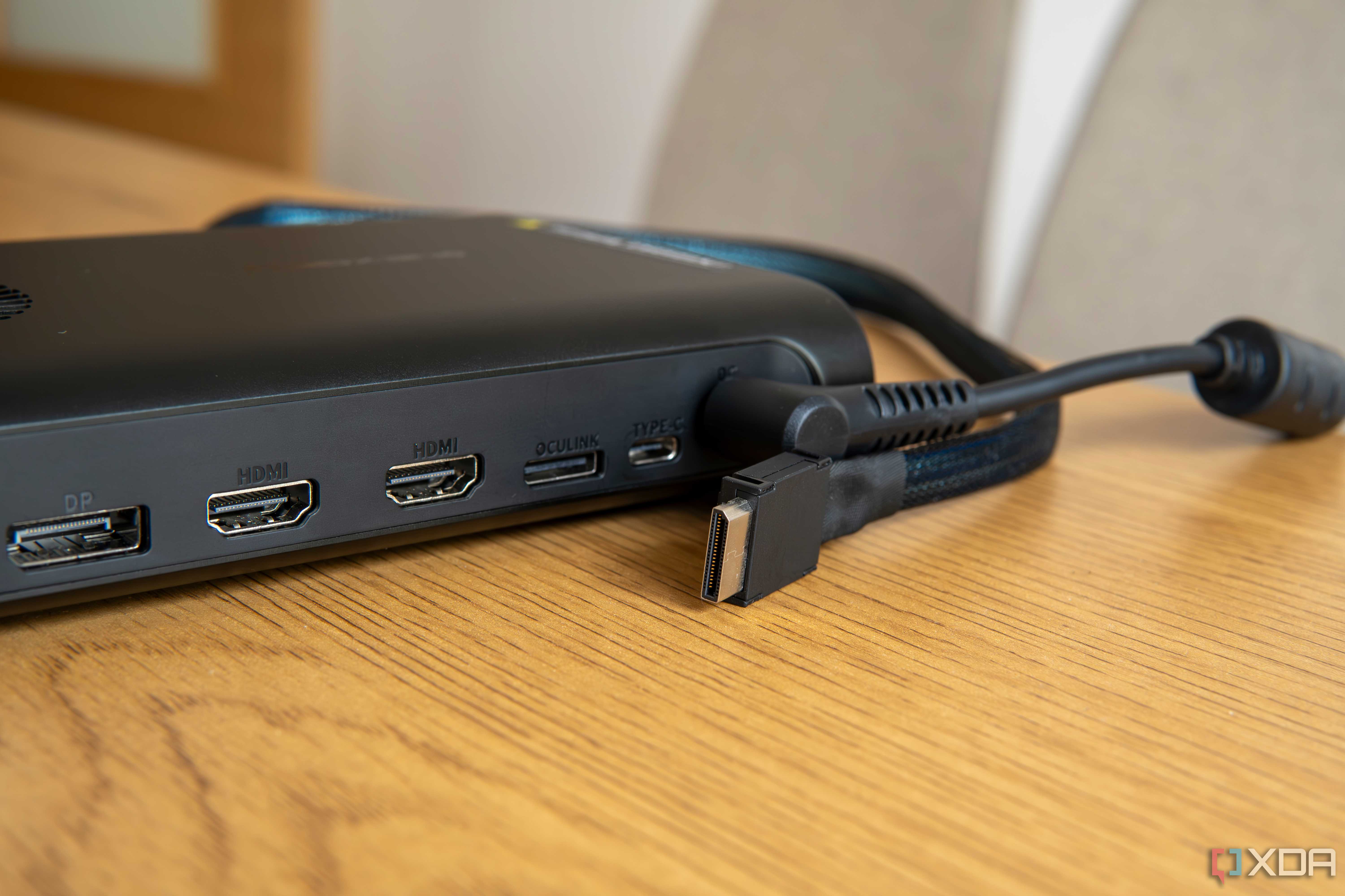Close-up of an external GPU with an OCuLink port and an OCuLink cable next to it