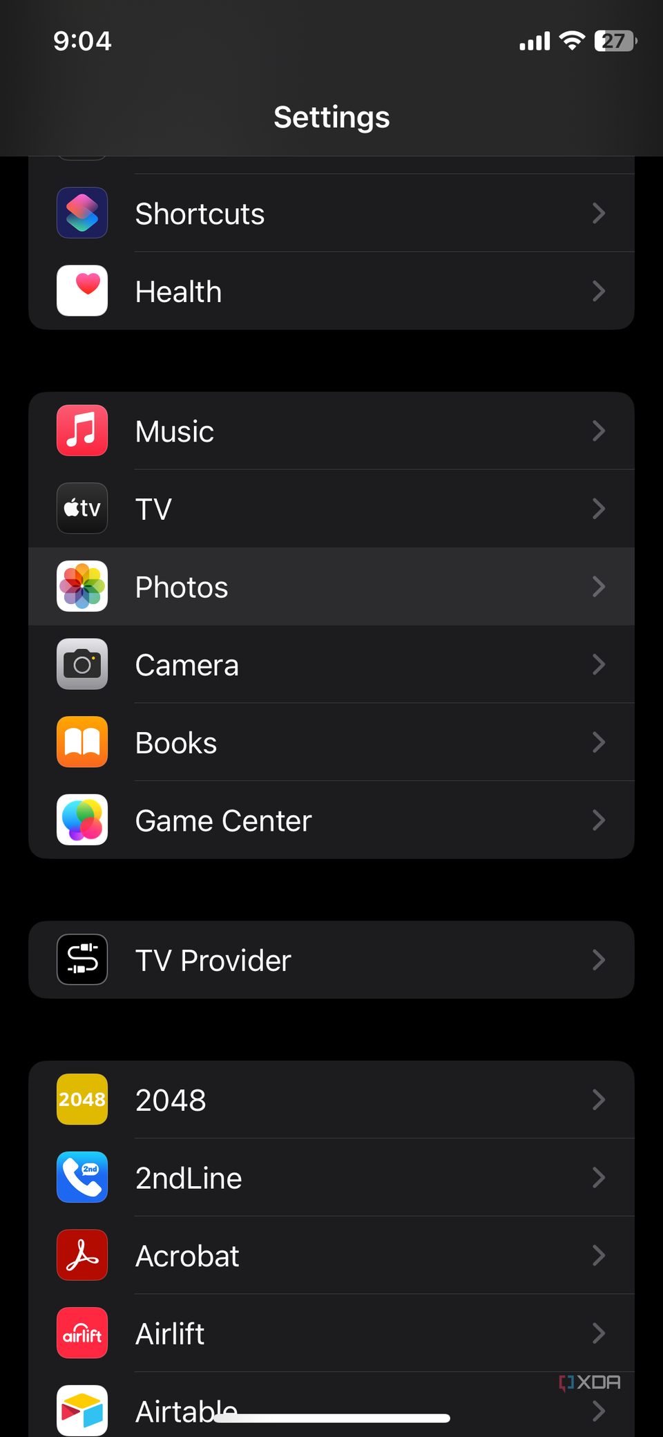 iPhone Settings app screenshot that highlights the Photos option