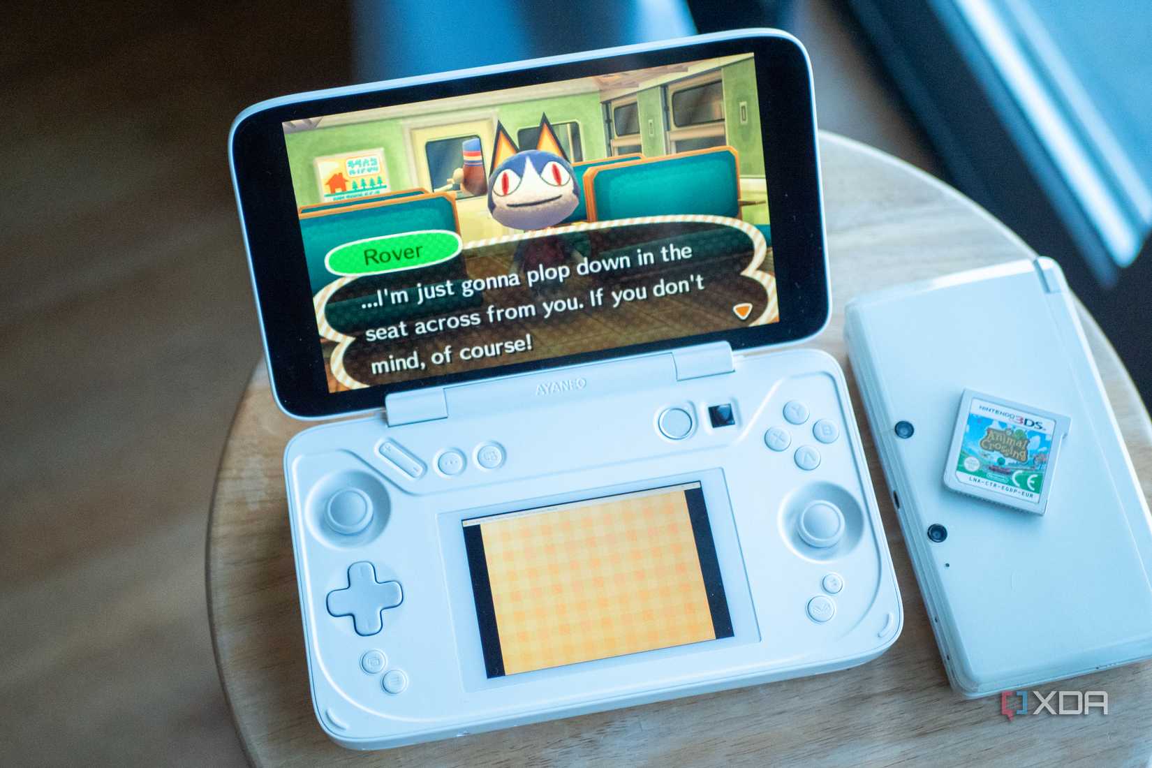 Ayaneo Flip DS running Animal Crossing New Leaf, beside a 3DS with a copy of the game