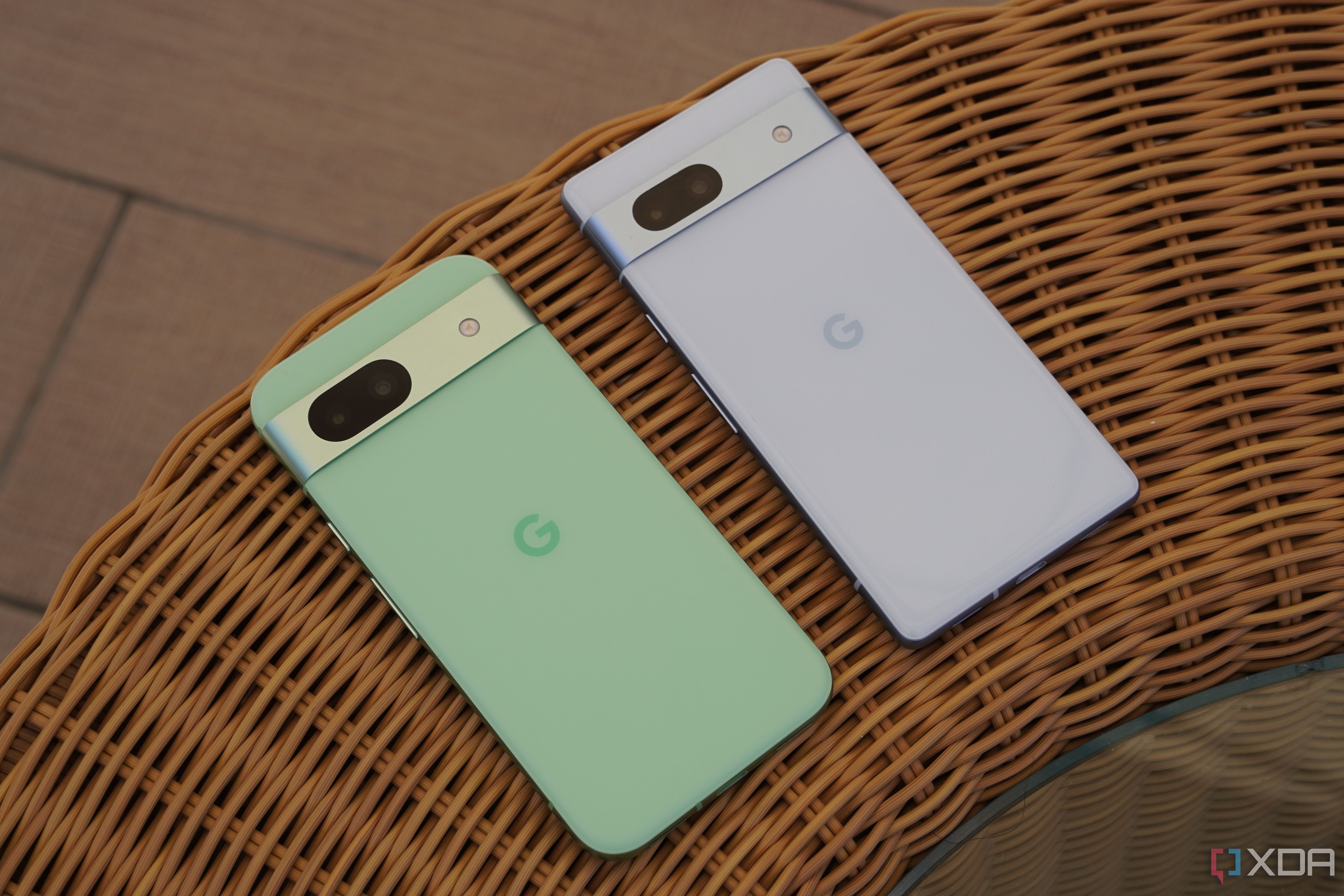 The Pixel 8a and Pixel 7a lying on a table.