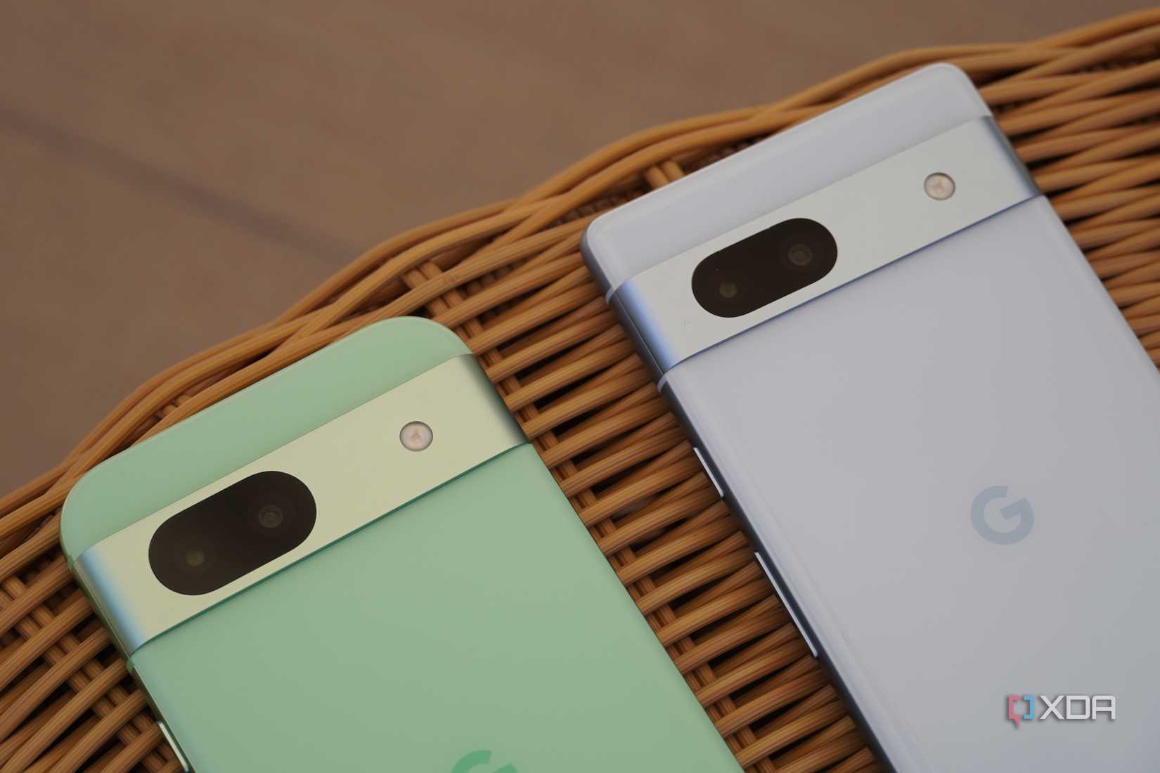 A close-up of the camera systems on the Pixel 8a and Pixel 7a.