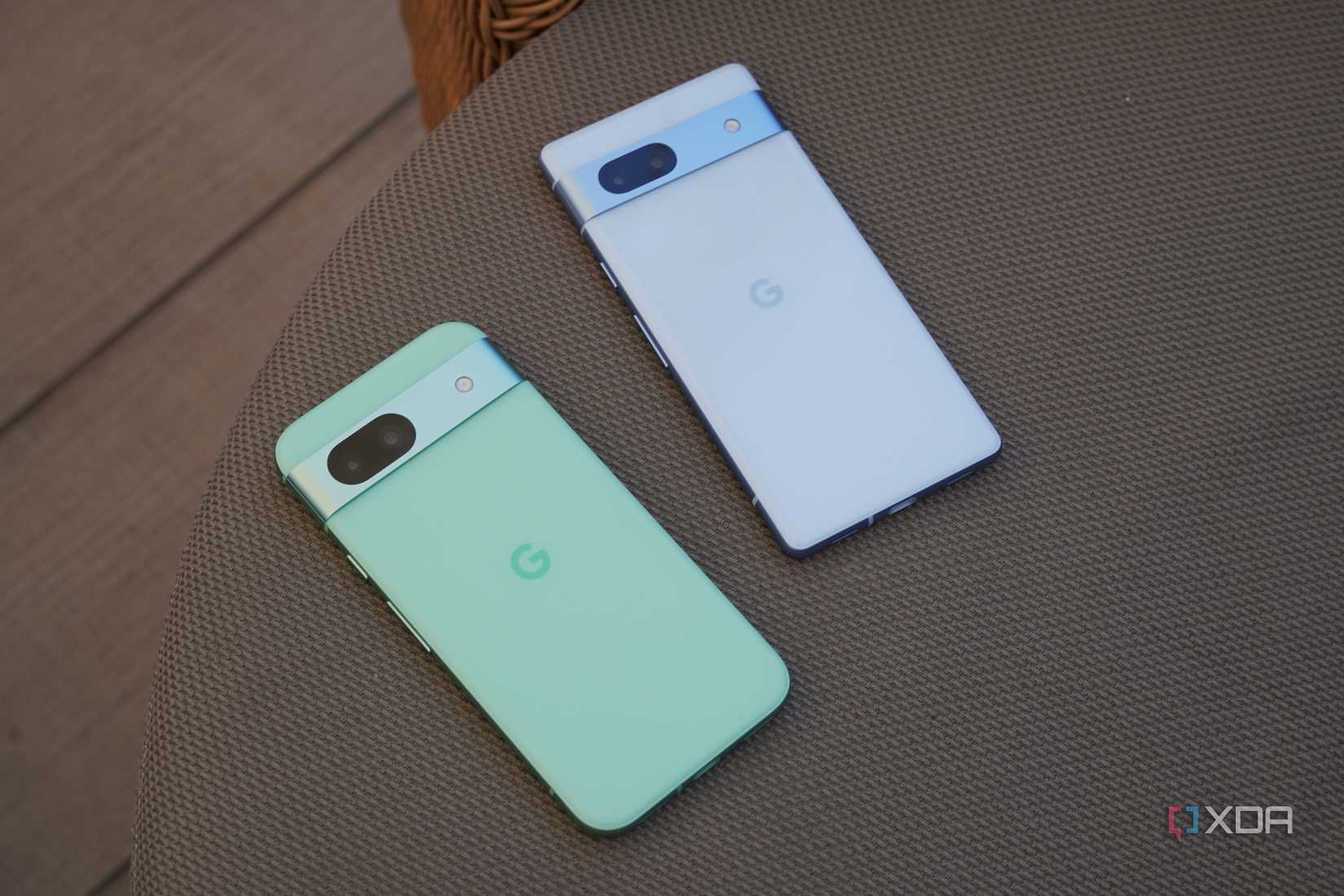 The Pixel 8a and Pixel 7a on a table.