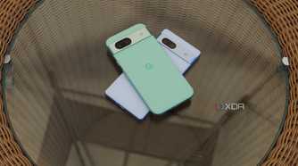 The Pixel 8a and Pixel 7a stacked on a glass table.