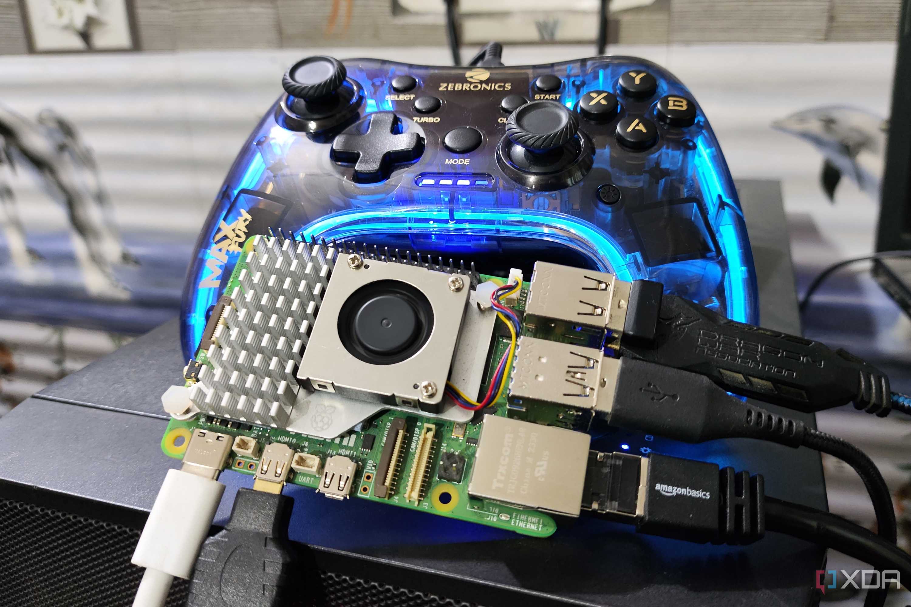 The Raspberry Pi 5 with a controller in the background