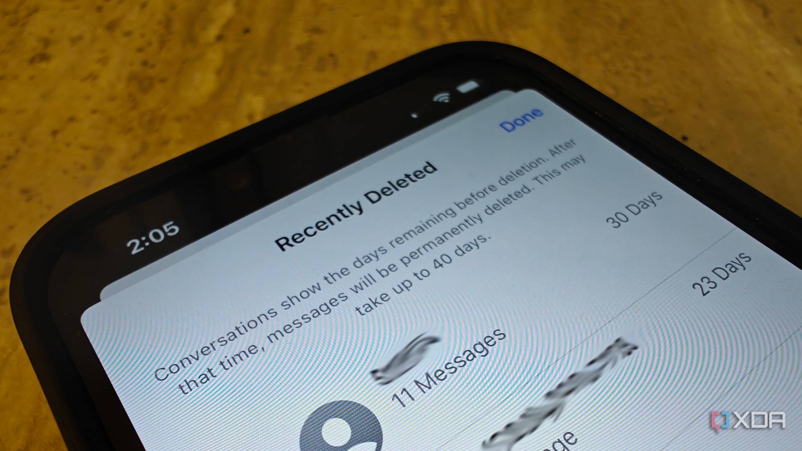 The top part of an iPhone showing Recently Deleted messages open.