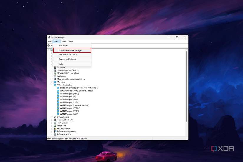 Windows 11 Device Manager screenshot that highlights the scan for hardware changes action.