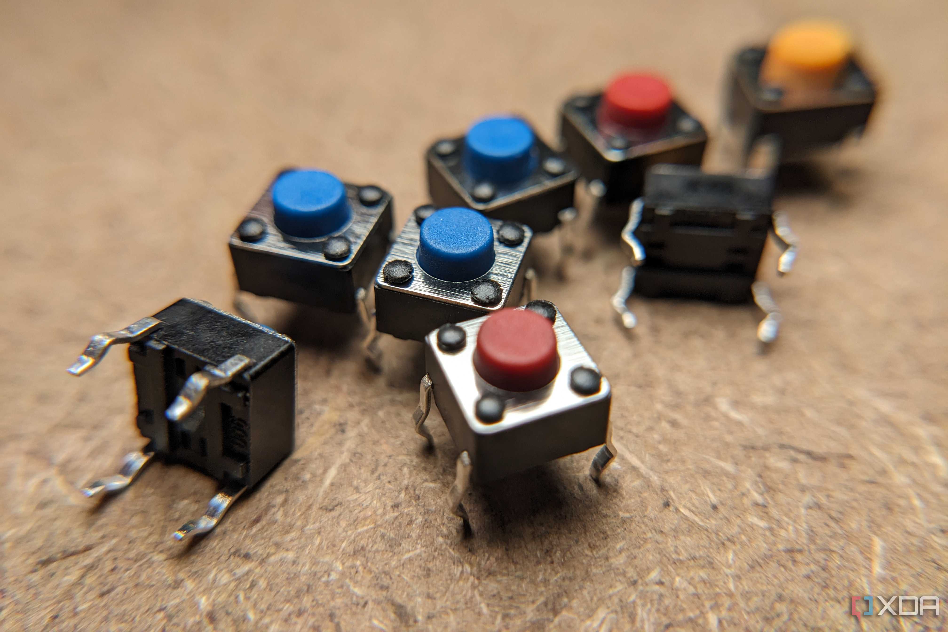 Eight small buttons on a wooden workbench