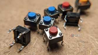 Eight small buttons on a wooden workbench