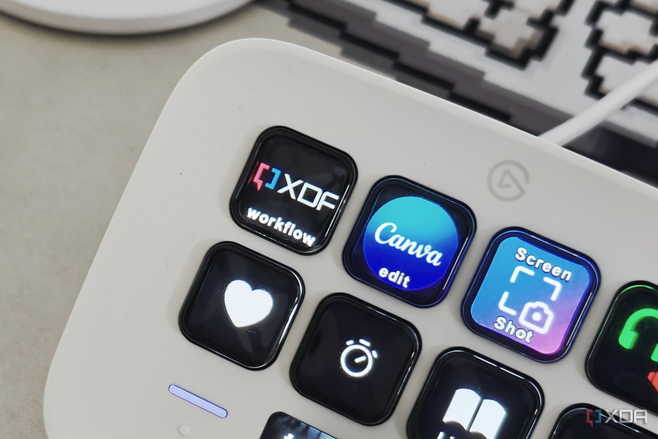 An image showing a key on the Stream Deck Neo with an XDA logo.