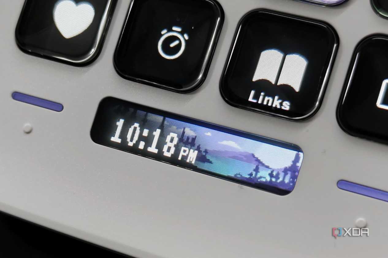 An image showing the Stream Deck Neo displaying a digital clock.