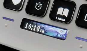 An image showing the Stream Deck Neo displaying a digital clock.