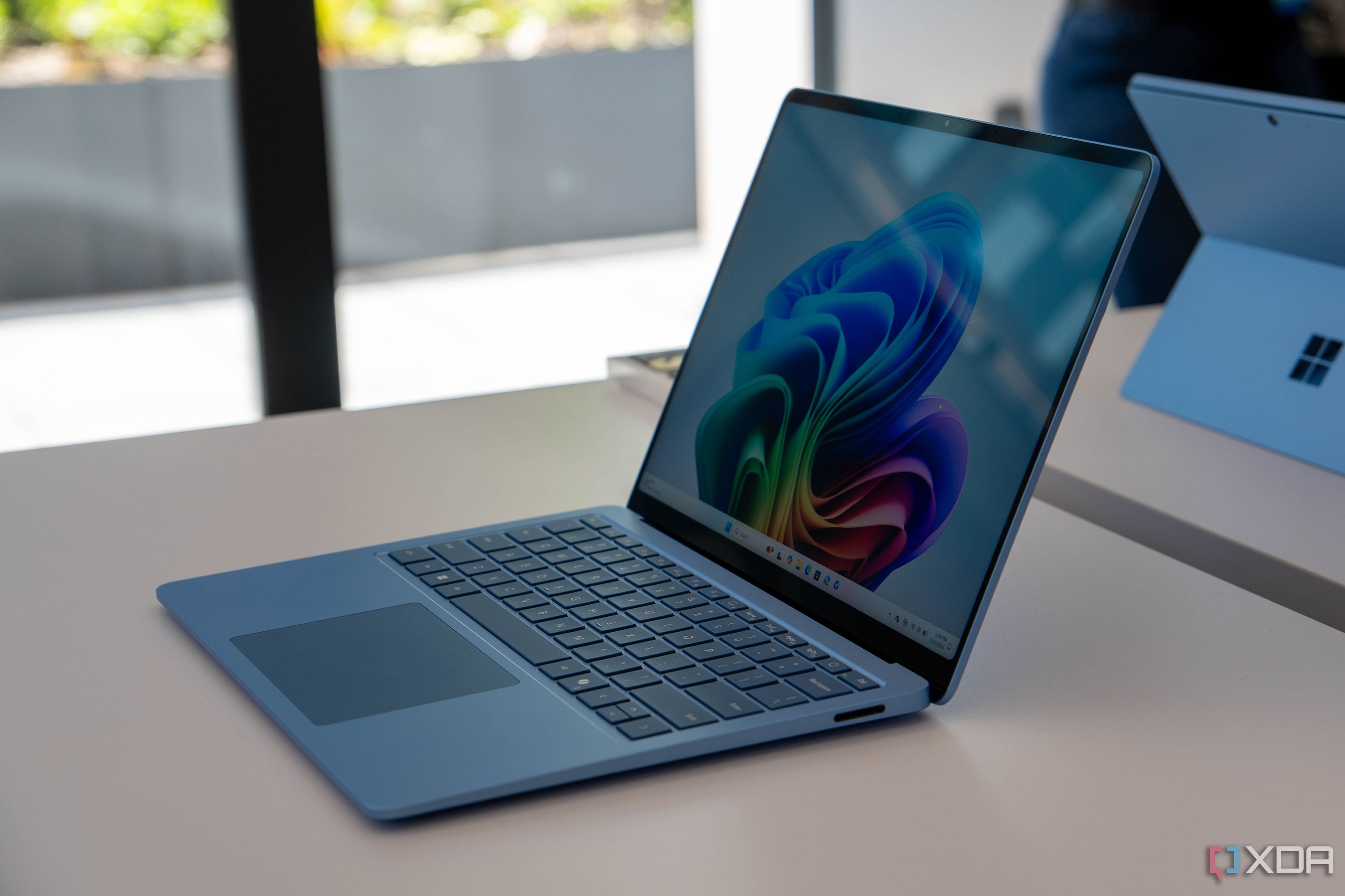 A Surface Laptop 7 on a table.