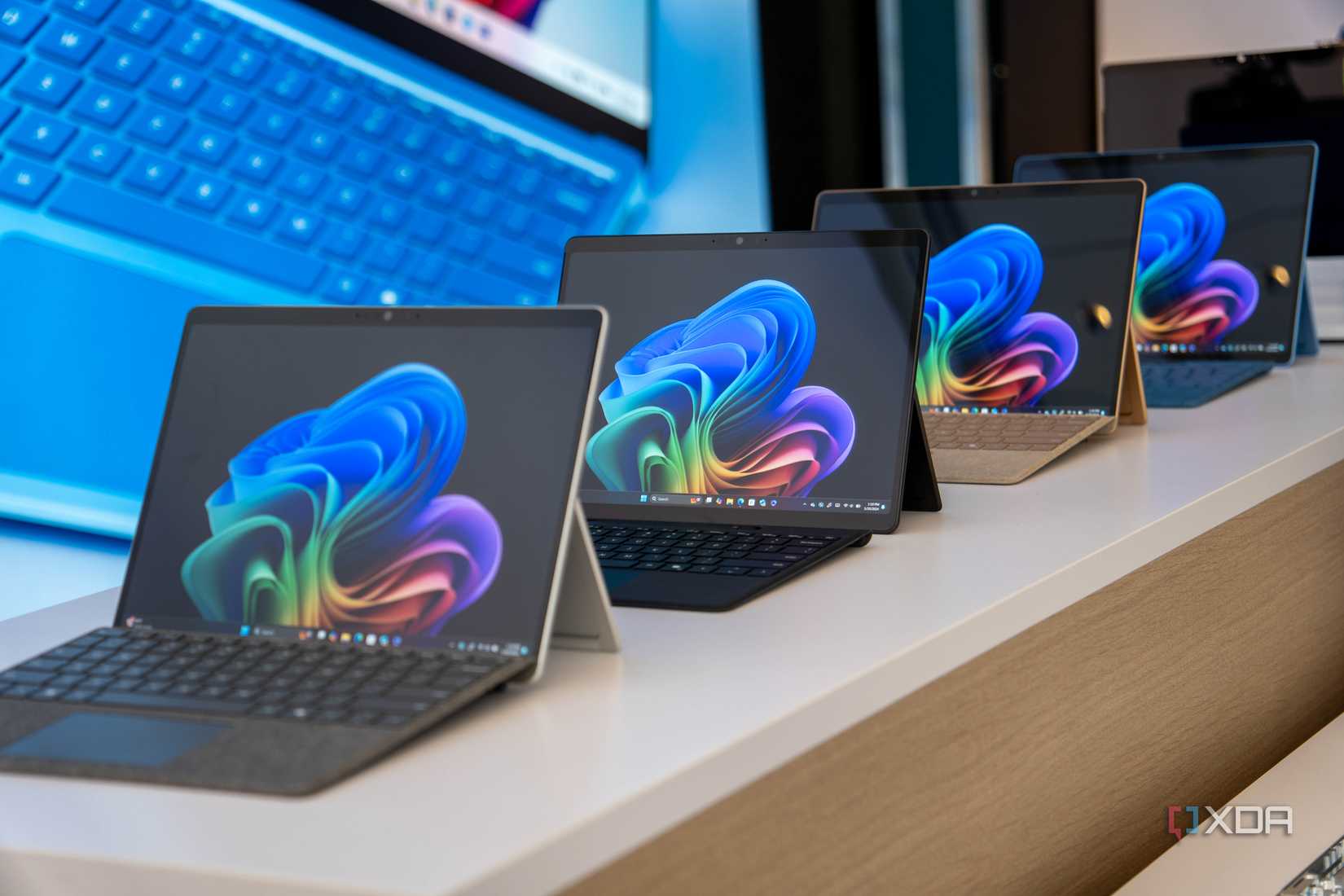 Surface Pro 11 devices on display at a Microsoft event