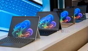 Surface Pro 11 devices on display at a Microsoft event.