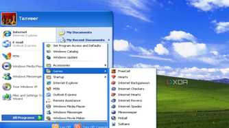 Screenshot of Windows XP desktop showing Start menu and pre-installed games