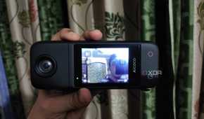 A person holding an Aicoco onAir camera