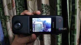 A person holding an Aicoco onAir camera