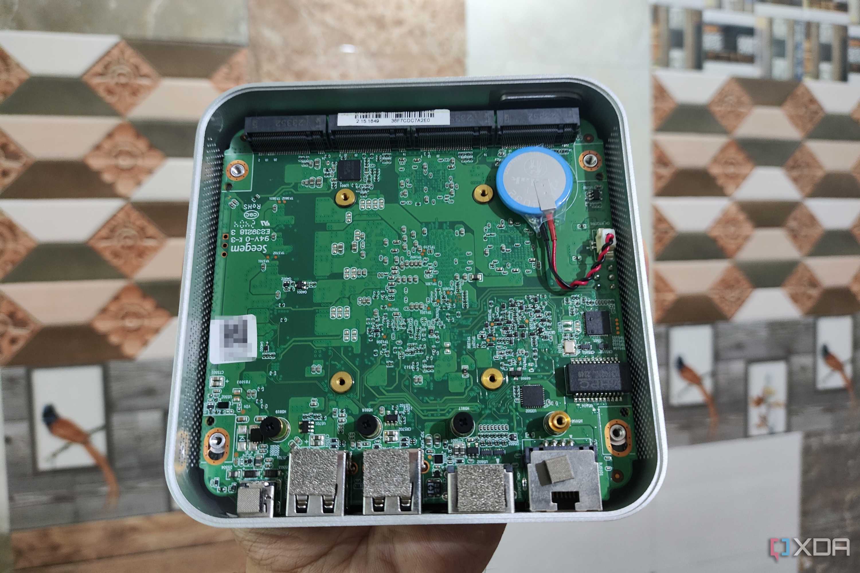 The internals of an Aiffro K100 NAS without the SSDs