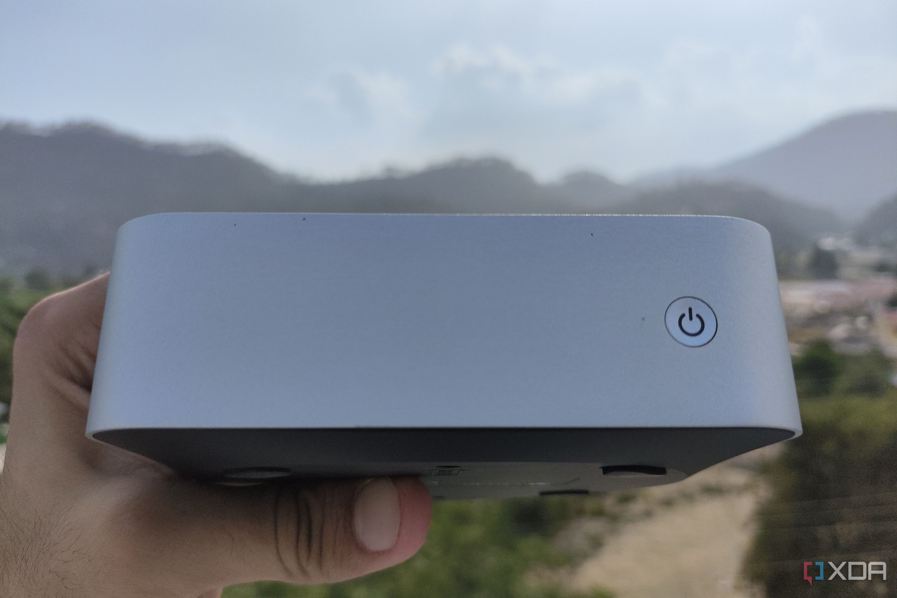 A person holding the Aiffro K100 NAS
