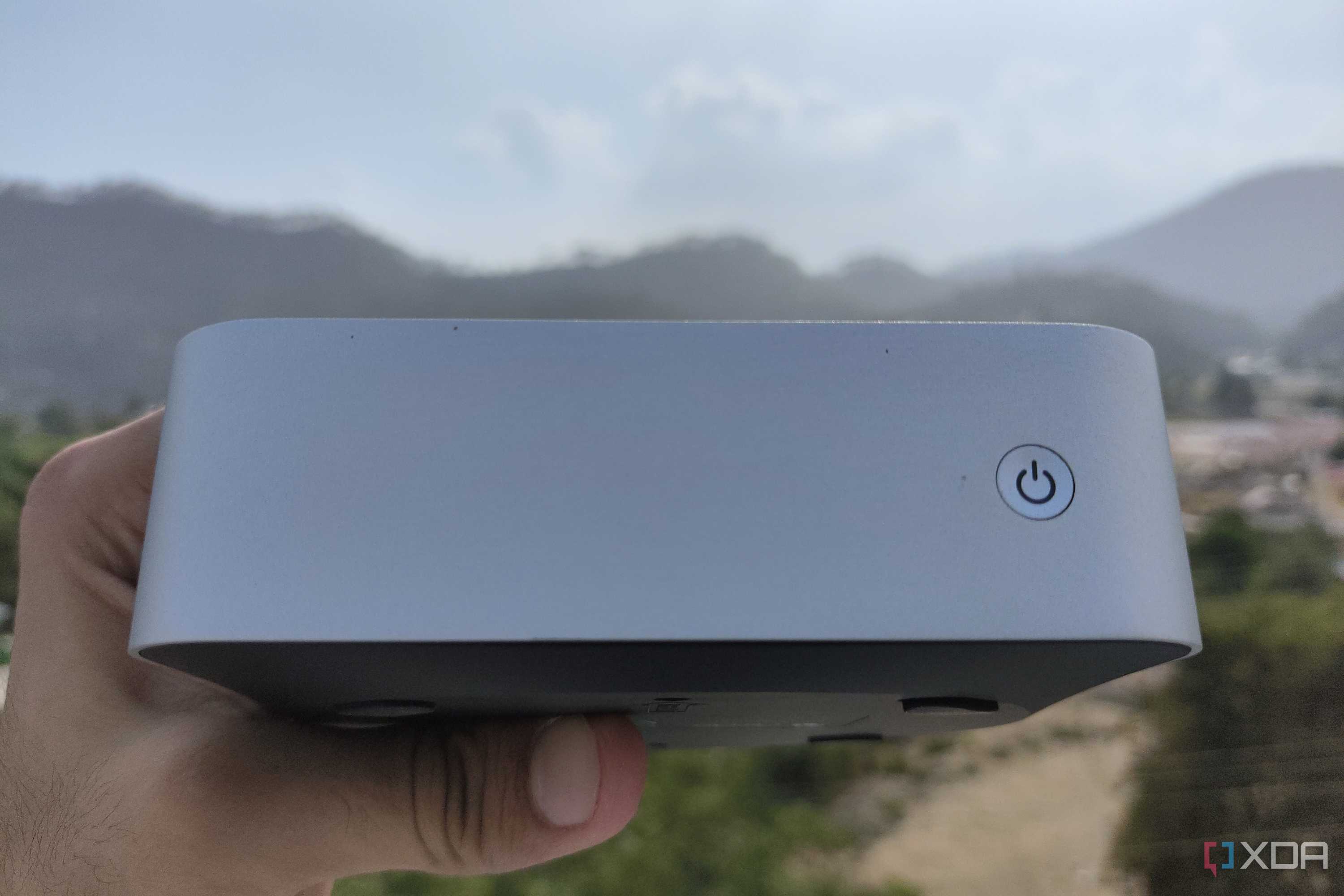 A person holding the Aiffro K100 NAS