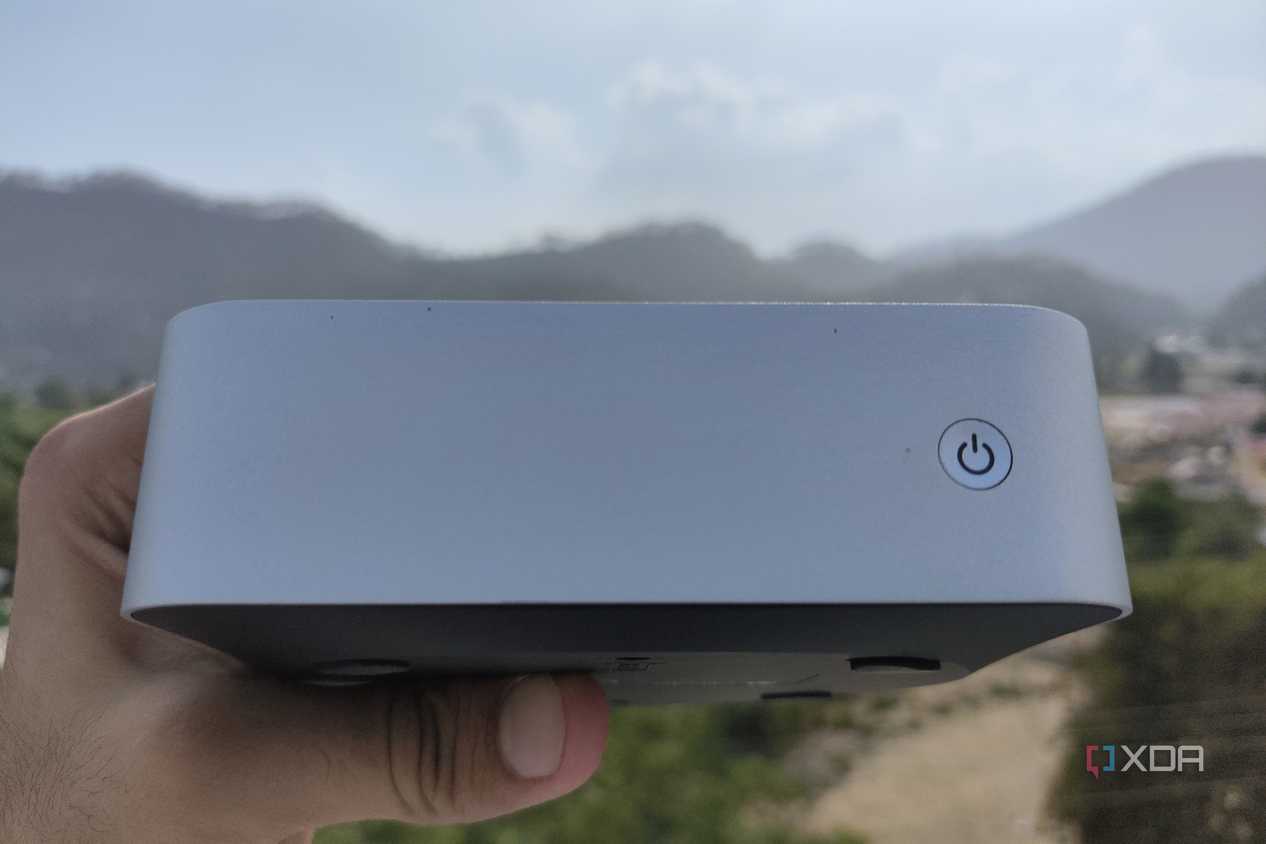 A person holding the Aiffro K100 NAS