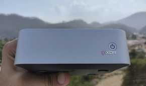 A person holding the Aiffro K100 NAS