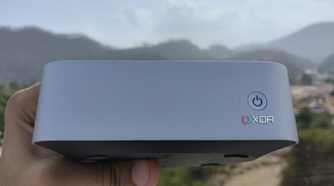 A person holding the Aiffro K100 NAS